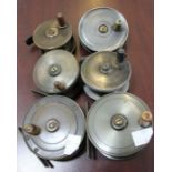 Six small fly fishing reels, brass and alloy