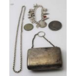 A silver purse with chain handle, Birmingham 1904, blue fabric interior,