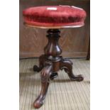 A mid 19th century swivel piano stool