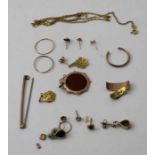 A quantity of 9ct gold and yellow metal items, includes a neck chain earrings, a bar brooch, pendant