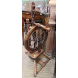 A vintage small wooden spinning wheel
