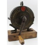 A "Spong's" Redseal knife polisher, metal construction with gilded lettering, wooden winding handle,
