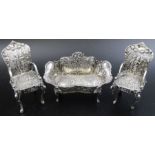 A miniature silver settee, London 1899, together with a pair of 19th century Dutch silver miniature