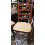 A set of four well made ladderback single chairs with rush seats