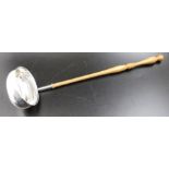 A Georgian design silver ladle, with turned wood handle, Birmingham 1991