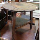 A 19th century oak two-tier cricket table, 62cm in diameter x 59cm high