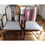A pair of pierced single slat backed armchairs with drop in seat pads 97 cm