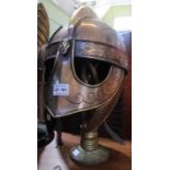 A Greek helmet with nose, ear & enclosing cheek covers with chainmail neck protection