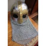 A full face enclosed helmet with chainmail neck protection.