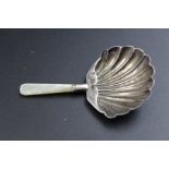 A Georgian caddy spoon with silver shell form bowl, and mother-of-pearl handle, Birmingham 1812