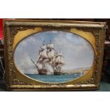 A gilt framed picture of a galleon under fire.