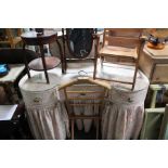 A fabric covered dressing table and shield shape dressing table mirror.
