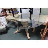A circular bevel glass topped table, on fancy carved & painted four legged baluster