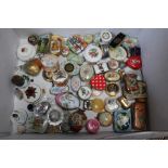 A collection of small decorative boxes and tins
