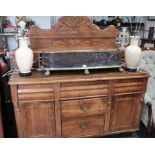 A 19th century pine sideboard, with decorative up-stand, fitted shelf & small drawers