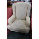 An old gold chenille armchair.