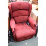 An HSL electric red upholstered recliner.