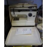 A Frister Rossmann sewing machine, with carry case