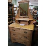 A pine dressing chest, three drawers with a mirror back.