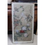 Oriental painting on fabric, depicts a bird amidst blossoms, framed