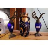 An Art Nouveau design gilded blue glass vase 23 cm high, plus a pair of decorative jugs.