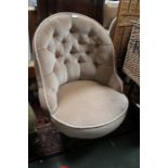 An early 20th century mushroom upholstered velour nursing chair