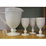 A large Sowerby style moulded opaque vitro porcelain (glass) jug together with three similar goblets