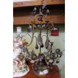 A pair of brass candle stands, hung with amber & lavender glass lustres, 50cm high