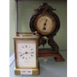 An Art Nouveau design probable German mantel timepiece together with a brass carriage clock, the ena