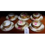 Six miniature hand painted Royal Worcester cabinet cups and saucers