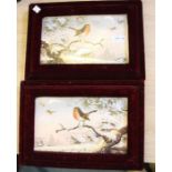 A pair of Japanese hand painted plaques, depicting robins in a winter landscape, each housed in a ve