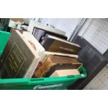 A crate containing a selection of books various to include a Jaguar service manual XK120 and mark