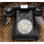 A vintage Bakelite dial telephone, model 164 TE 45/1