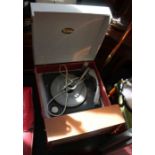 An original mid-century two tone Dansett floor standing record player, supported on four tapering le