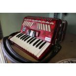 ' Stella ' half size accordion, pearl red finish.