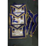 A case containing three Masonic provincial lodge aprons and three collars
