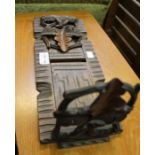 A Black Forest carved wood extending book stand