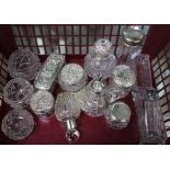 A good selection of glass pots some with silver lids