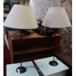 A pair of modern metal based table lamps, with decorative shades