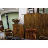 A bedroom suite c.1930, comprising wardrobe, tall boy and dressing table with mirror back