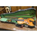 A vintage unnamed violin with two piece back with an unnamed modern bow - cased