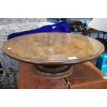 A large wooden table top lazy Susan