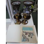 A pair of oriental cloisonné vases with twin handles and plain wood stands
