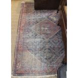 A geometric patterned woven woollen floor carpet over 100 years old 132 x 195 cm
