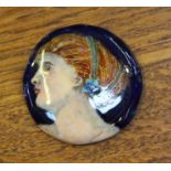 A circular female portrait enamelled plaque