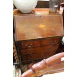 An Edwardian mahogany bureau, fall inset patera, fitted three drawers, brass handles, on bracket fee