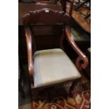A William IV mahogany framed open armchair, scroll arms, on turned fore legs, upholstered drop-in se
