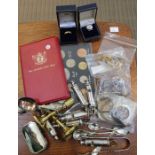 Six Police whistles, candlesticks, bag of coins, ring, badge, jewellery etc.