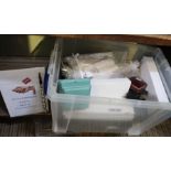 A plastic crate containing new and vintage jewellery boxes and a selection of bracelet fastening aid