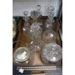 A selection of cut glass decanters plus two biscuit barrels